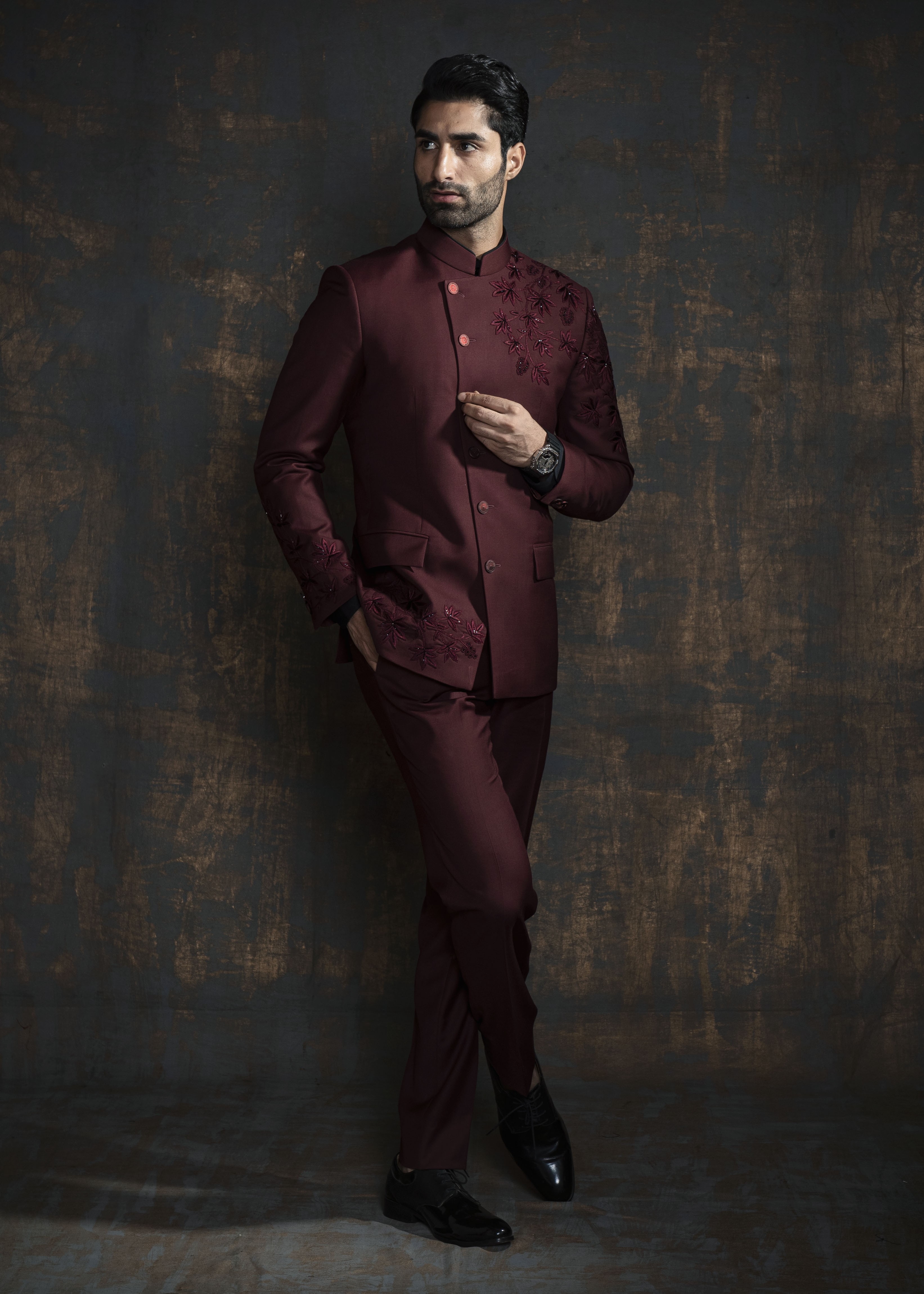Red designer bandgala suit with thread embroidery which is further enhanced with carefully crafted hand embroidery.