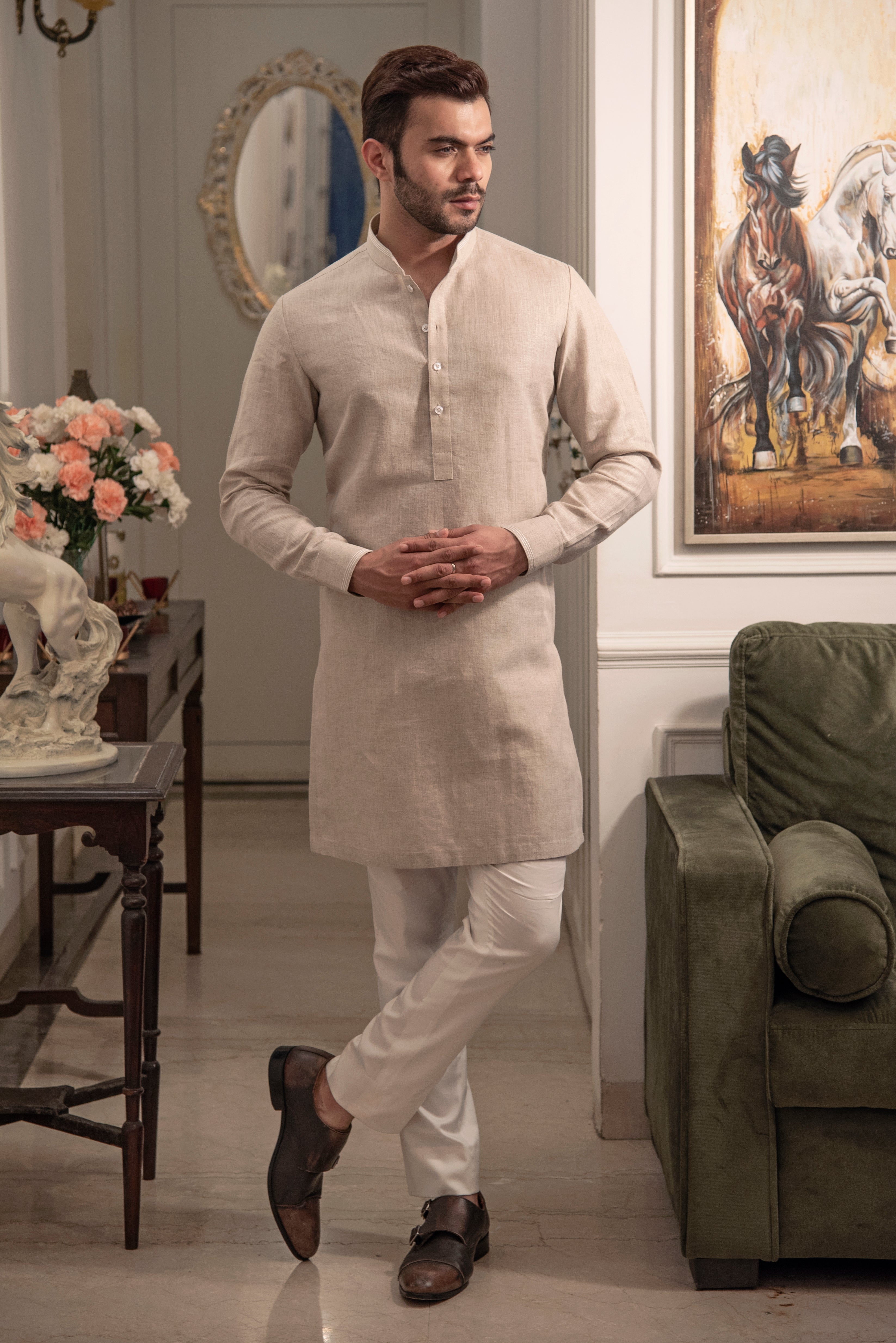 Beige linen kurta with ivory pants.