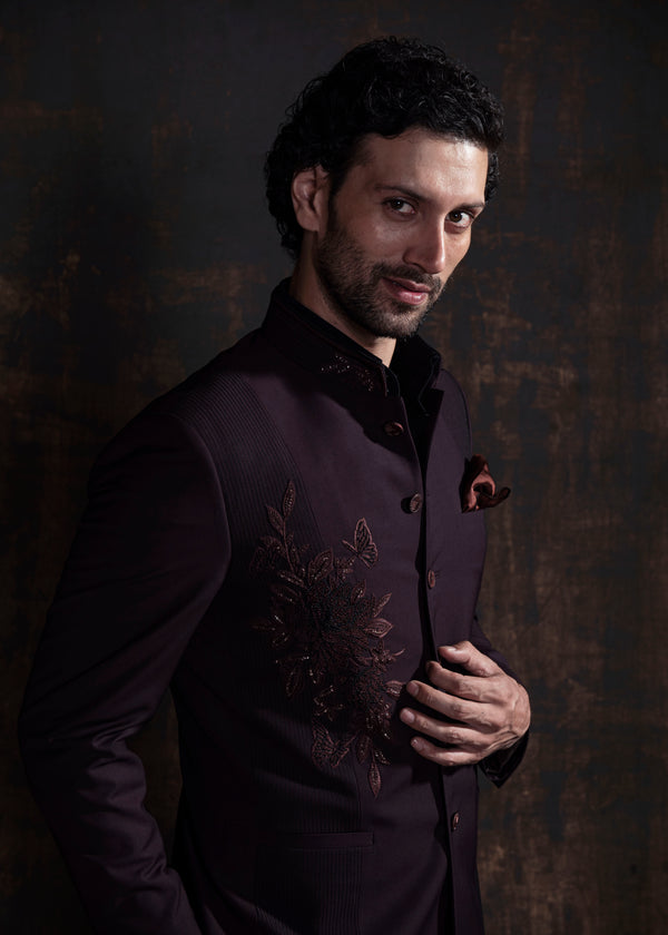 Wine coloured designer bandgala jacket with black vertical thread work and self on self embroidery.  Paired up with jet black pants.