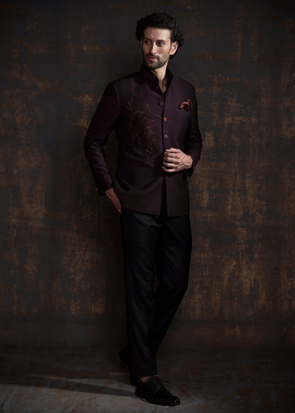 Wine coloured designer bandgala jacket with black vertical thread work and self on self embroidery.  Paired up with jet black pants.