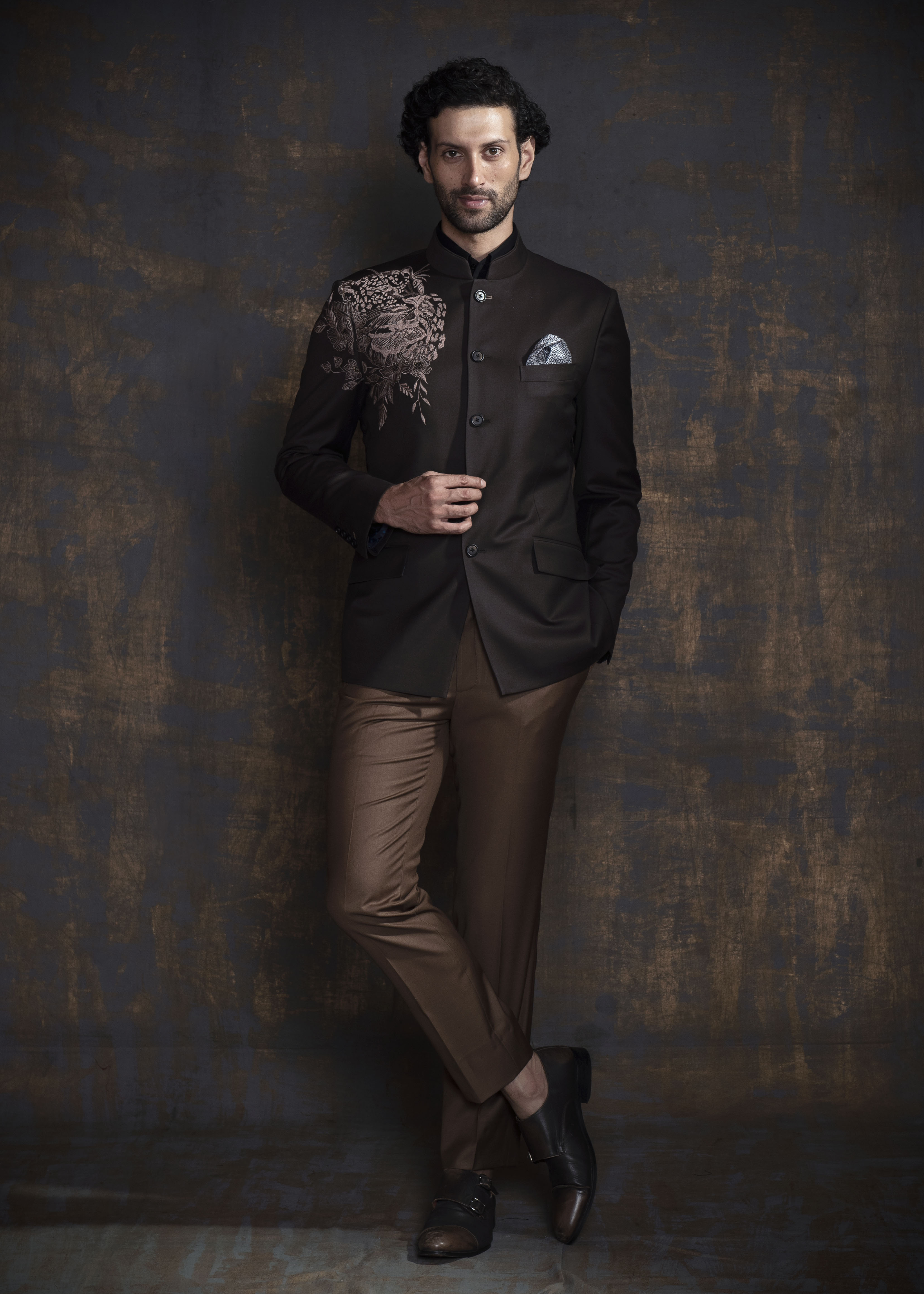 Deep brown bandgala jacket with light brown embroidery. Paired up with caramel coloured pants.