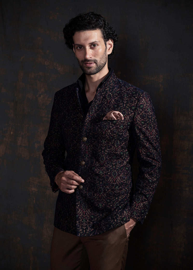 Multicoloured embroidered bandgala jacket. Paired up with caramel coloured pants.