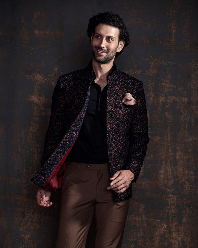 Multicoloured embroidered bandgala jacket. Paired up with caramel coloured pants.