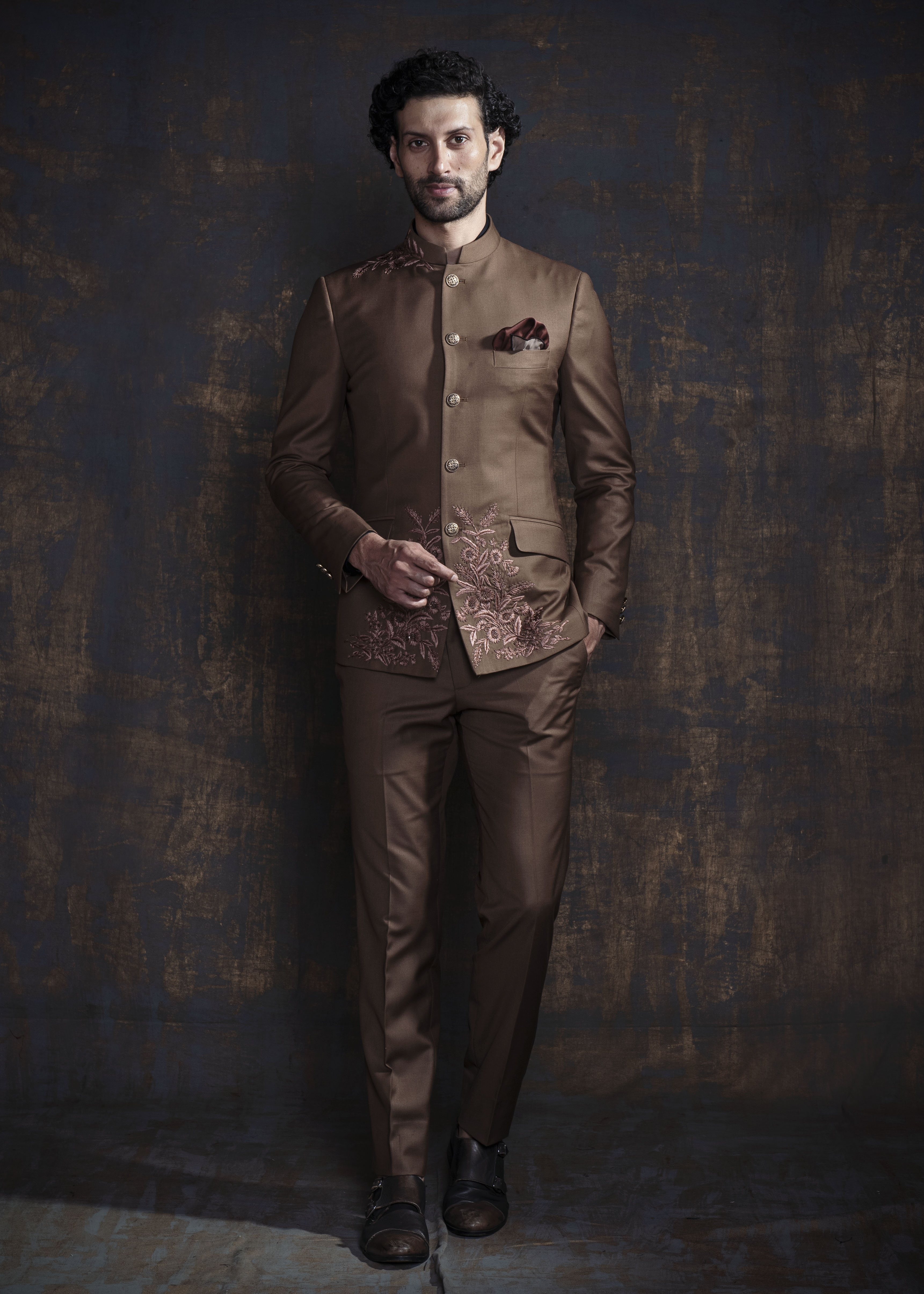 Brown bandgala suit with self on self floral embroidery.