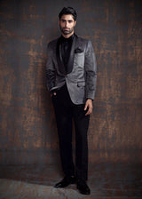 Grey velvet tuxedo with silver grey embroidery.  Paired up with jet black pants.