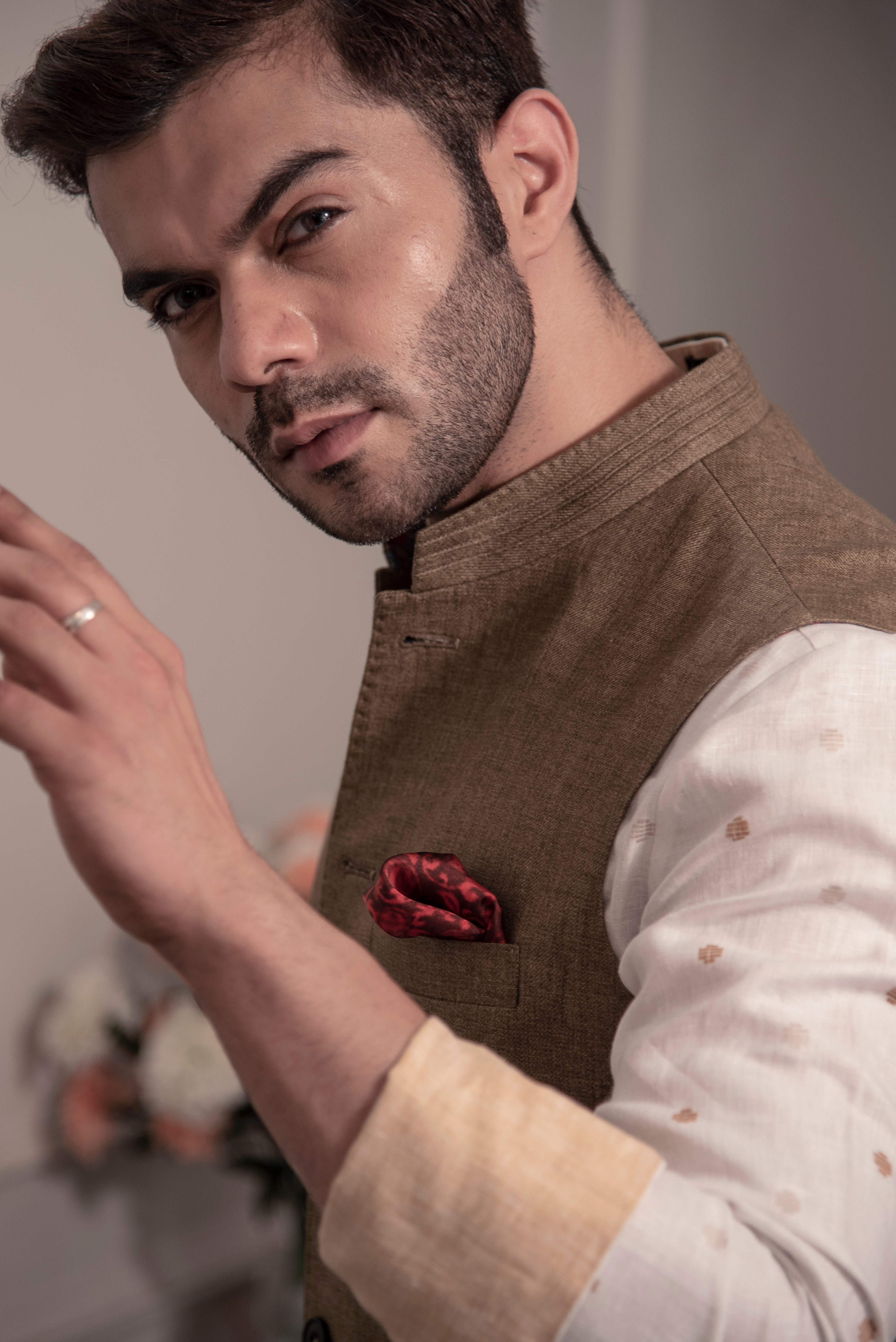 Earthy brown nehru jacket with off white printed kurta and off white pajama.