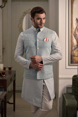 Powder blue raw silk nehru jacket with designer light blue kurta and ivory pant pajama.