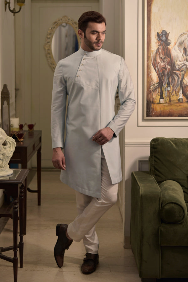 Pista green designer kurta. Paired up with ivory pant cut pajama.