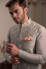 Grey embroidered nehru jacket with grey coloured kurta and off white pant pajama.