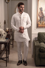 Ivory classic nehru jacket with patch pockets. Paired up with off white kurta pajama.
