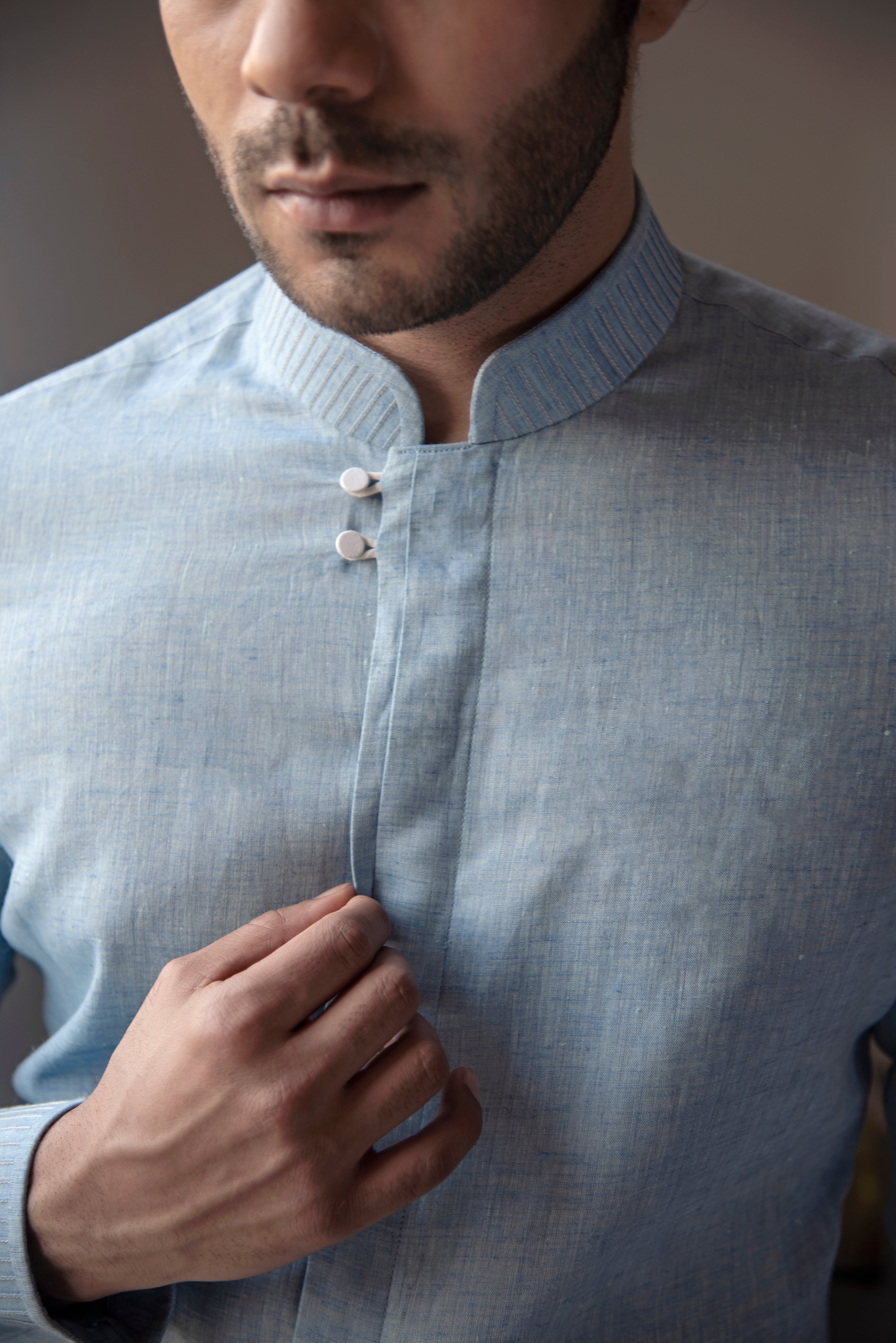 Designer blue linen shirt.