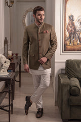 Olive coloured, safari look bandgala jacket. Paired up with off white short kurta and pant cut pajama.