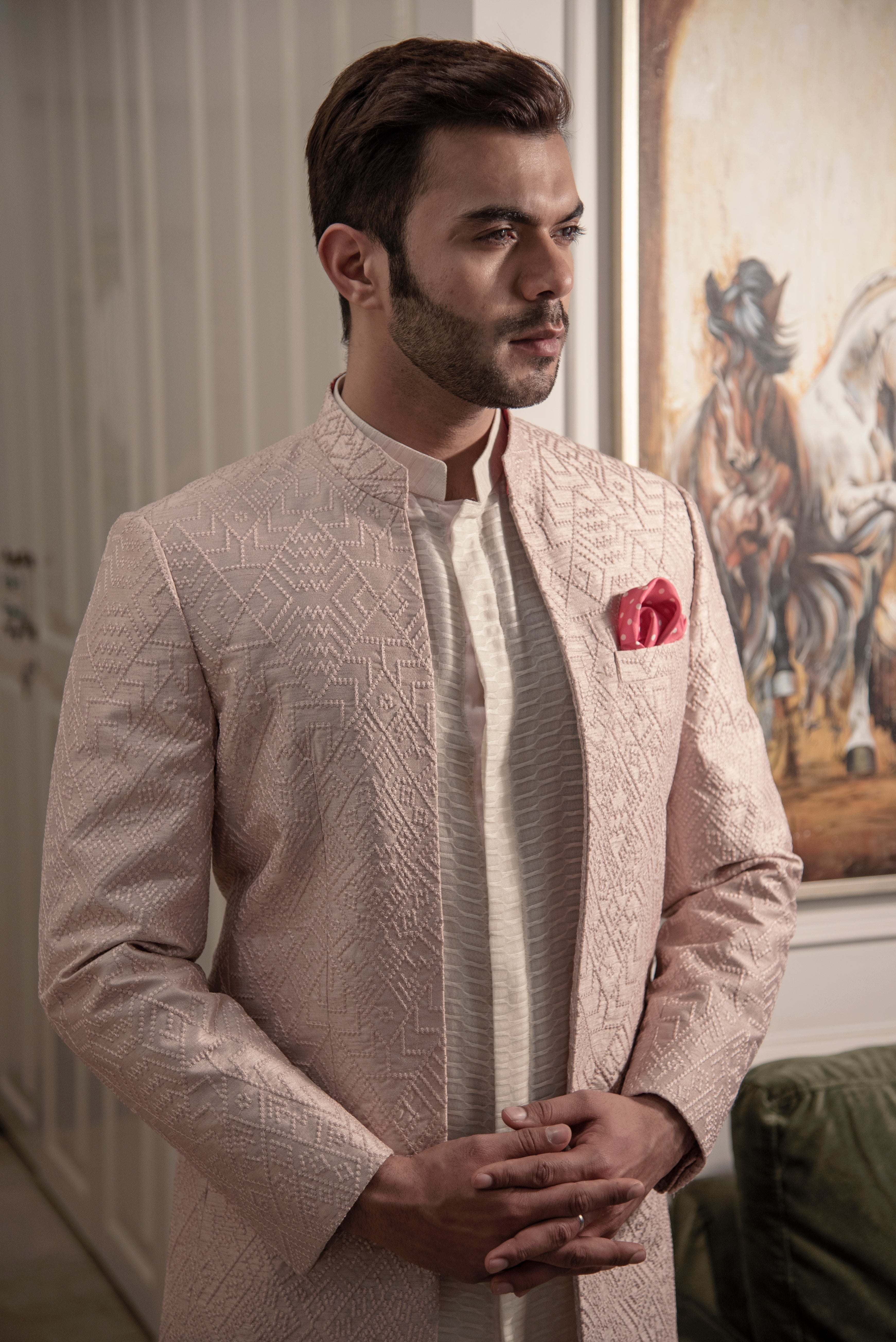 Powder pink embroidered bandgala jacket in open look style. Paired up with embroidered off white long shirt and pant cut pajama.