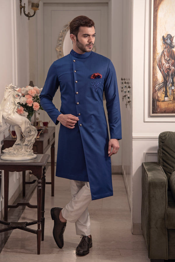 Blue designer indo cut kurta with self blue coloured embroidery. Paired up with ivory pants.