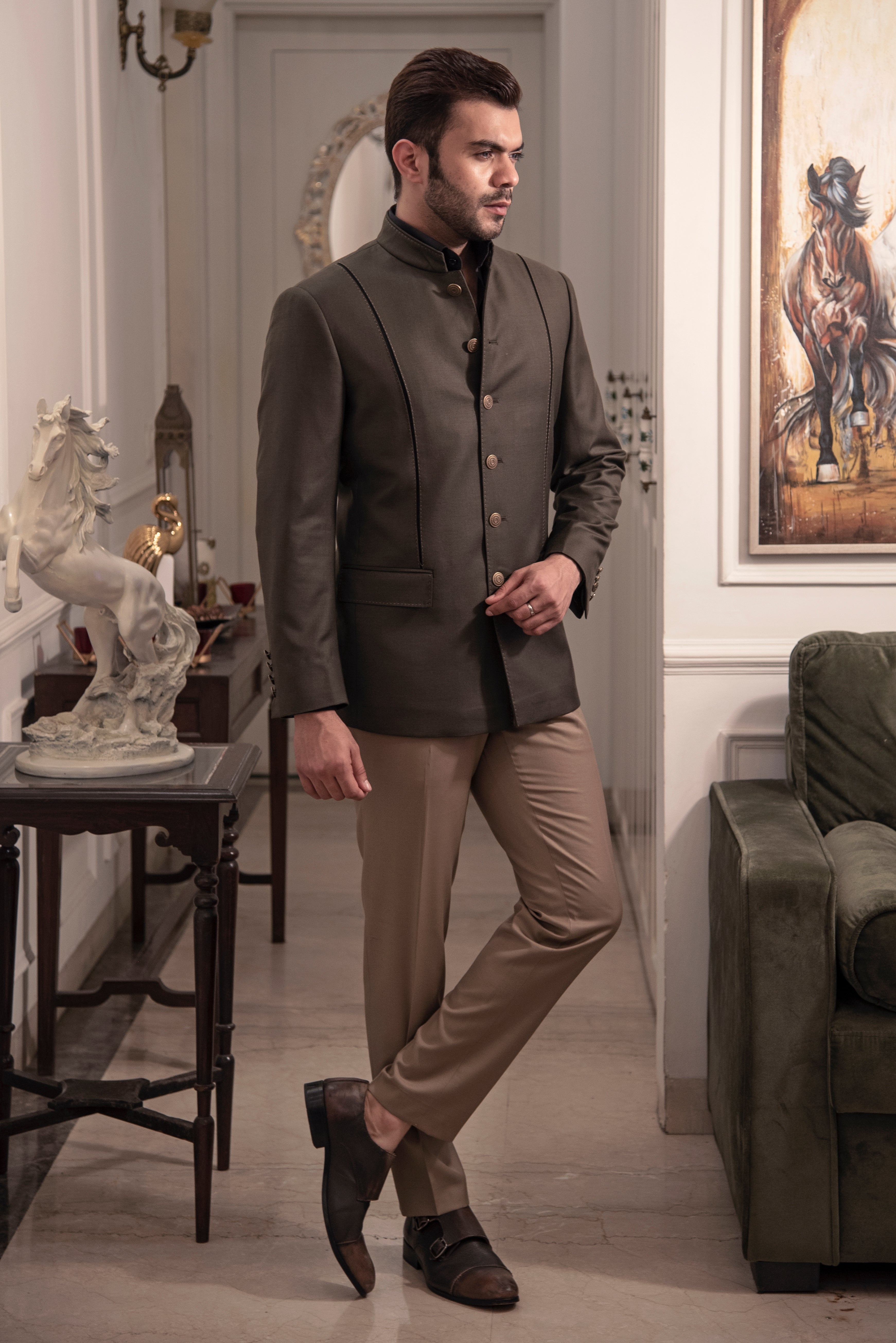 Dark olive coloured designer bandgala jacket. Paired up with beige pants.