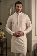 Classic ivory kurta with pin tuck running vertically on the sides. Paired up with ivory pant cut pajama.