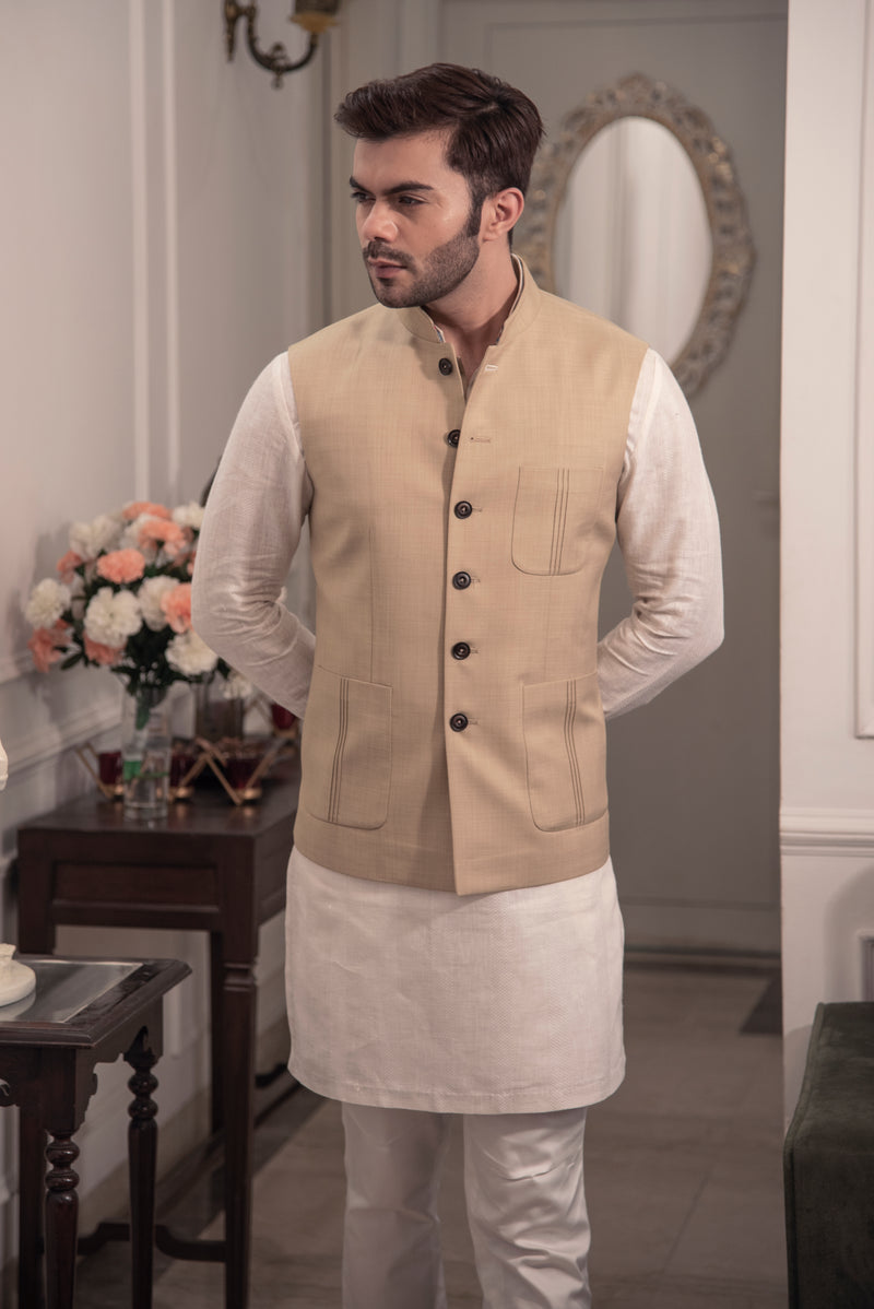 Classic beige nehru jacket.  Paired up with off white kurta pajama.