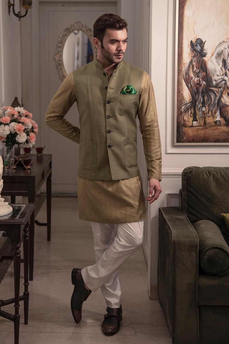 Mehndi green nehru jacket with green self textured kurta and off white pant cut pajama.