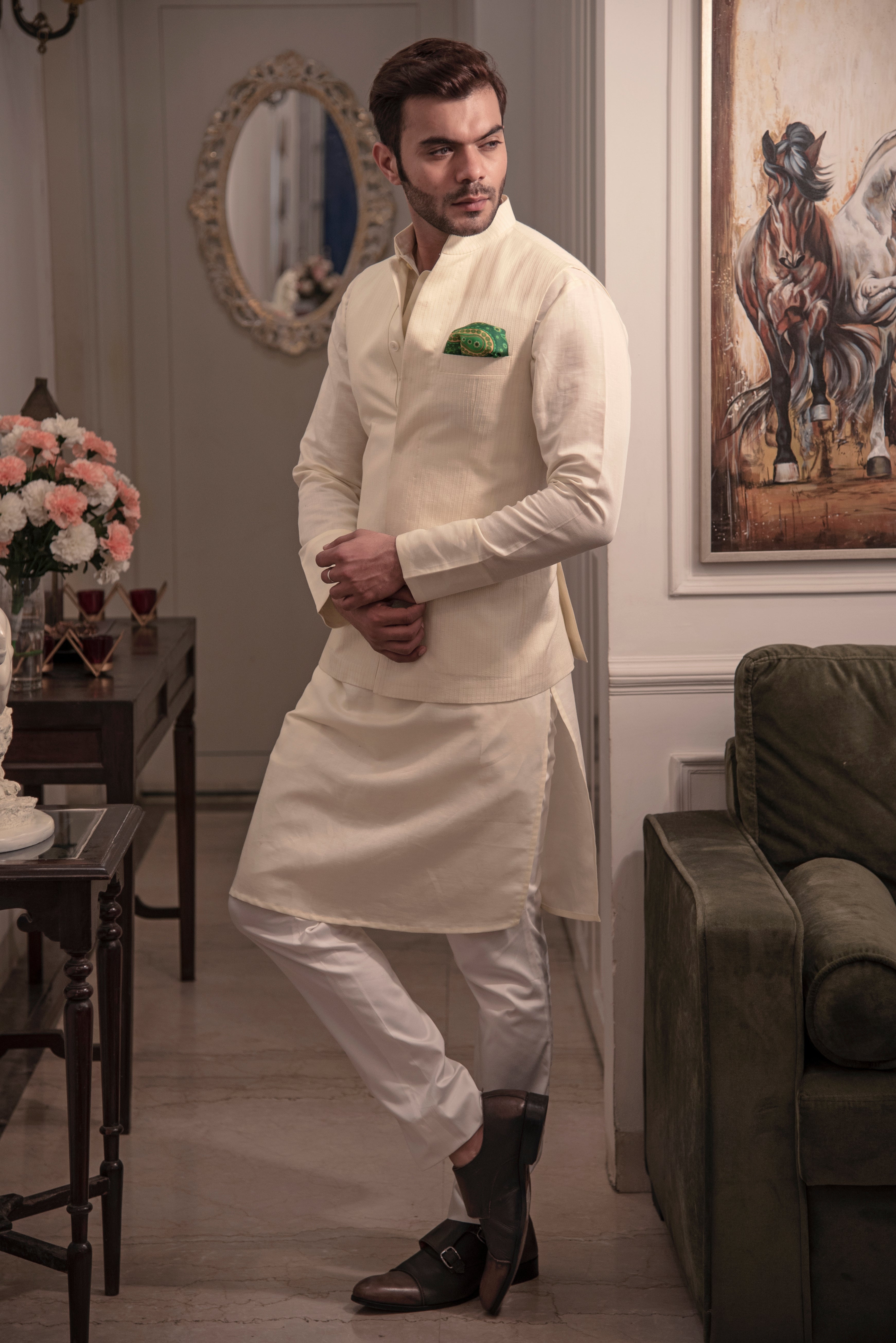 Cream coloured nehru jacket with cream coloured kurta and off white pant pajama.