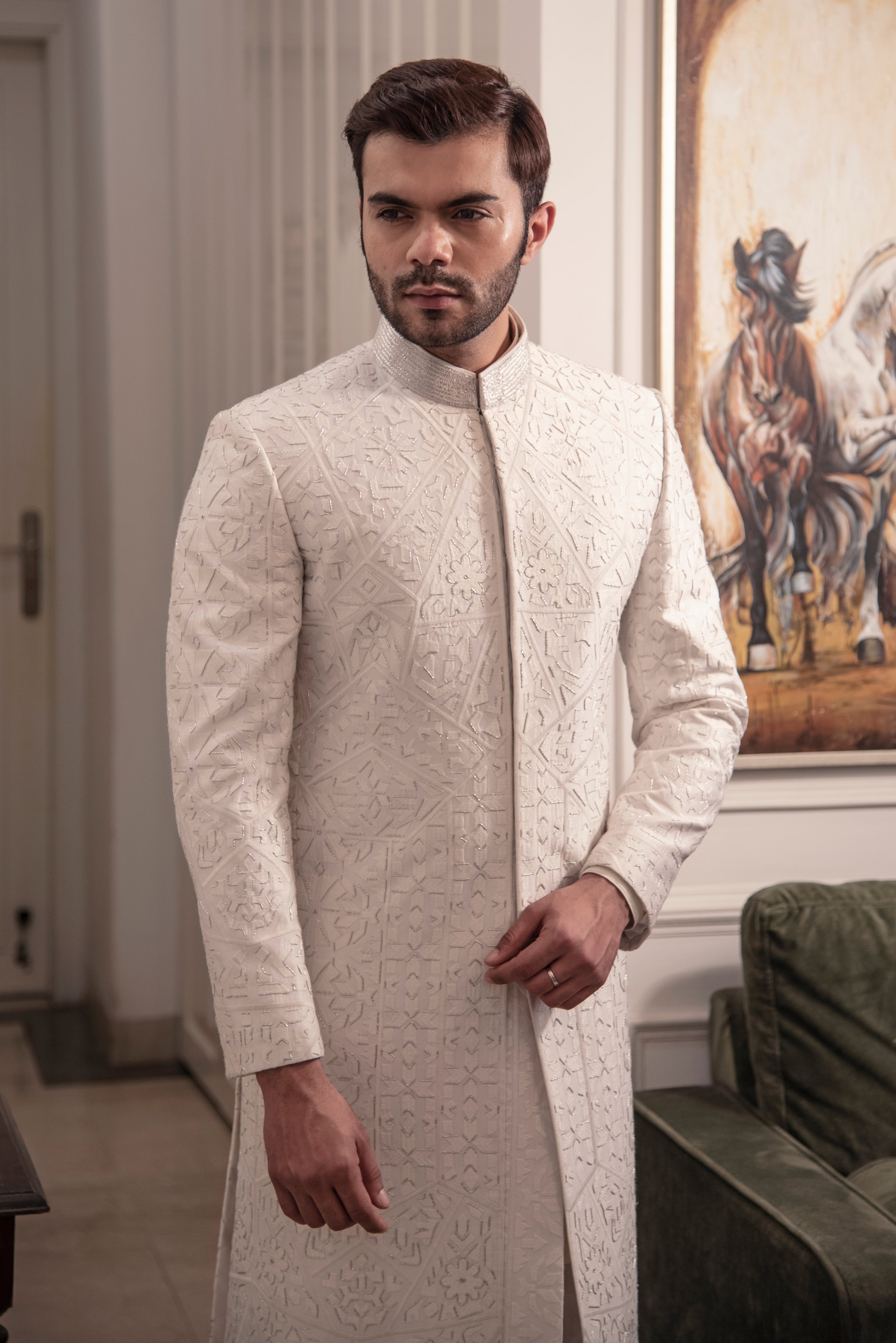 Ivory self embroidered sherwani with off white kurta pajama.