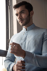 Designer blue linen shirt.
